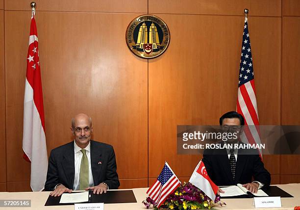 Home Security Secretary Michael Chertoff with Singapore Minister for Home Affairs Wong Kan Seng at a signing of intent between both countries in...