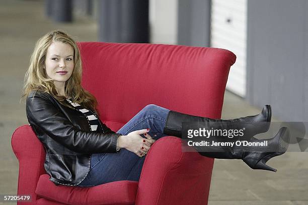 Actress Amanda Holden poses for photographers during Shelter's Red Chair Sit-in photocall at the Oxo Tower Wharf on March 29, 2006 in London,...