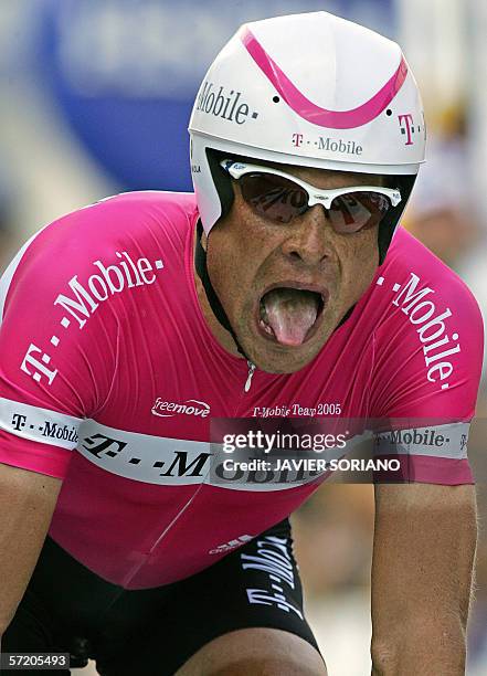 Saint-Etienne, FRANCE: FILES - A picture taken 23 July 2005 shows German Jan Ullrich pulling his tongue out as he crosses the finish line of the 20th...