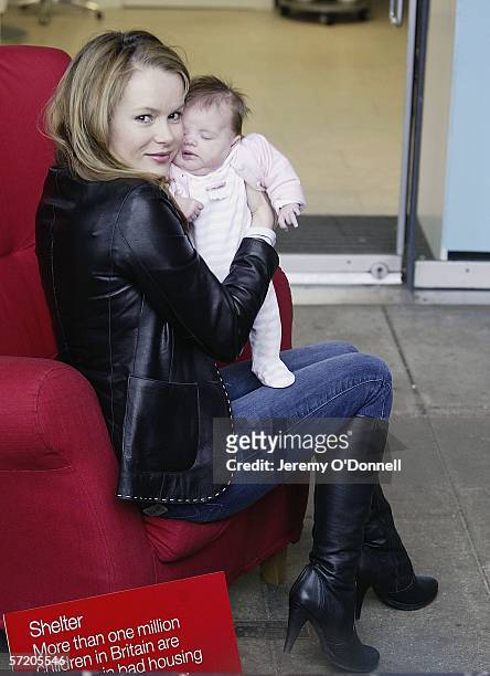 Actress Amanda Holden poses with her nine week old baby Lexi during Shelter's Red Chair Sit-in photocall at the Oxo Tower Wharf on March 29, 2006 in...