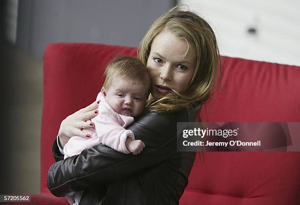 Actress Amanda Holden poses with her nine week old baby Lexi during Shelter's Red Chair Sit-in photocall at the Oxo Tower Wharf on March 29, 2006 in...