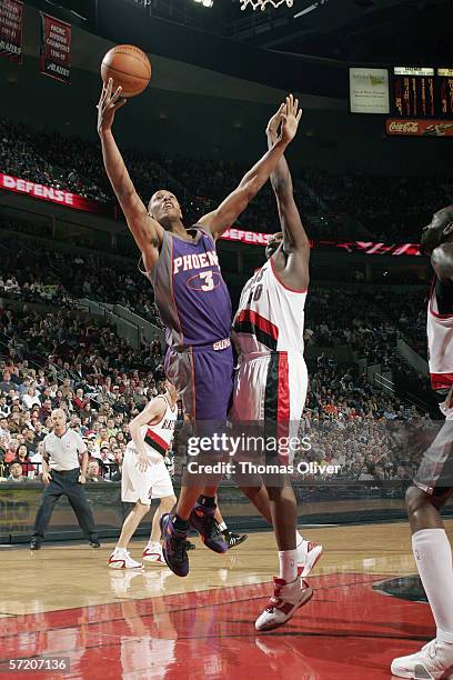 Boris Diaw of the Phoenix Suns goes to the basket against Zach Randolph of the Portland Trail Blazers during the game at the Rose Garden on March 12,...