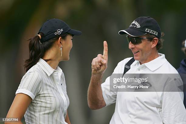 Michelle Wie and her coach David Leadbetter during a practice round of the Sony Open at the Waialae Country Club on January 10, 2006 in Honolulu,...