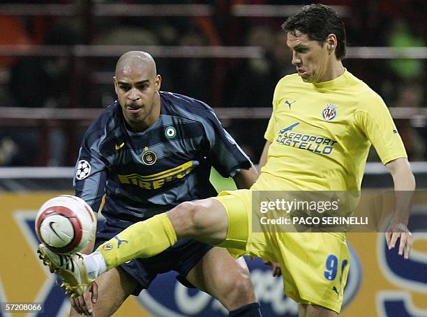 Inter Milan's forward Adriano of Brazil fights for the ball with Villarreal's forward Guillermo Franco of Argentina during their Champions League...