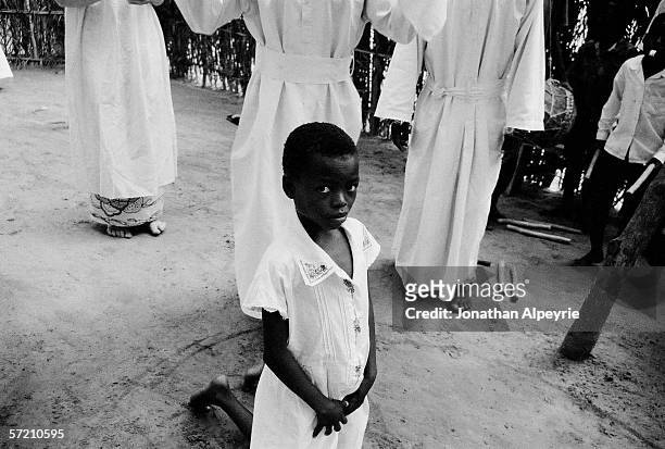 Year old girl going through an exorcist ceremony after being accused of possessing demons inside her November 13, 2003 in Congo. She is the first of...