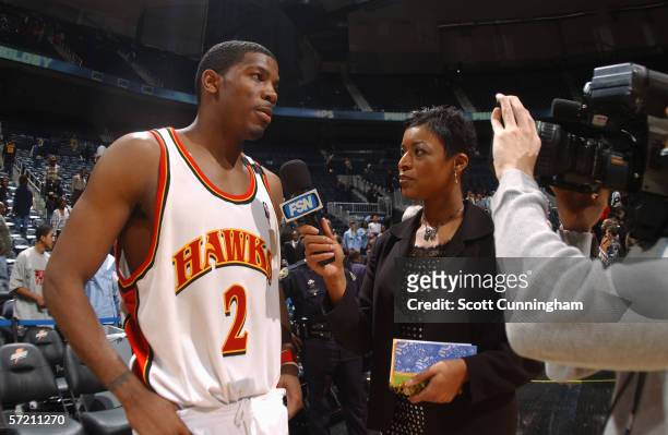 Joe Johnson of the Atlanta Hawks is interviewed by FOX Sports Net reporter Sandy Williams following the game against the Golden State Warriors at...