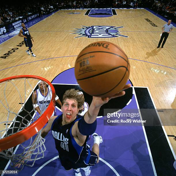 Dirk Nowitzki of the Dallas Mavericks shoots a layup against the Sacramento Kings during the game at ARCO Arena in Sacramento, California, on Mach...