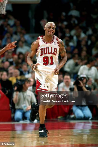 Dennis Rodman of the Chicago Bulls runs on the court during game two, round two of the NBA Playoffs against the New York Knicks at Chicago Stadium on...