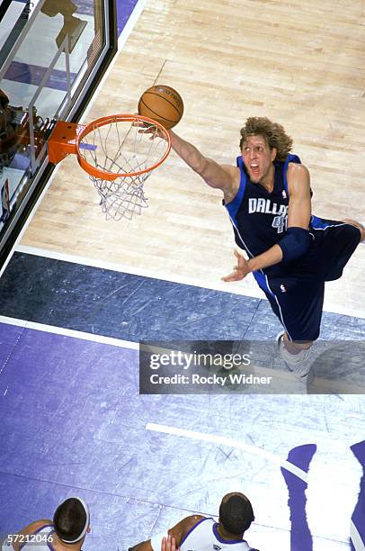 Dirk Nowitzki of the Dallas Mavericks shoots a layup against the Sacramento Kings during the game at ARCO Arena in Sacramento, California, on Mach...