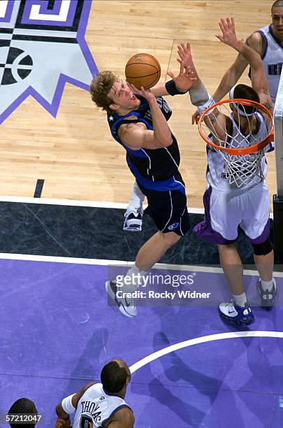 Dirk Nowitzki of the Dallas Mavericks shoots against the Sacramento Kings during the game at ARCO Arena in Sacramento, California, on Mach 12, 2006....