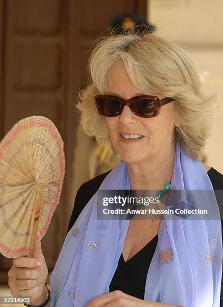 Camilla, Duchess of Cornwall fans herself in the heat as she visits the arts and craft market at the Jodhpur fort on the eleventh day of a 12 day...