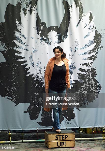 Mary Poppins star Laura Michelle Kelly poses with a seven-foot angel figure at a photocall to launch the Global Angels charity's Step Up campaign,...