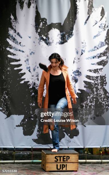 Mary Poppins star Laura Michelle Kelly poses with a seven-foot angel figure at a photocall to launch the Global Angels charity's Step Up campaign,...