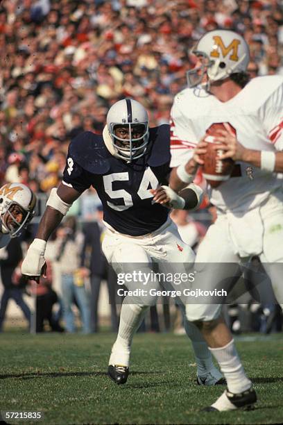 Defensive lineman Bruce Clark of the Penn State University Nittany Lions in action against the University of Maryland at Beaver Stadium on November...