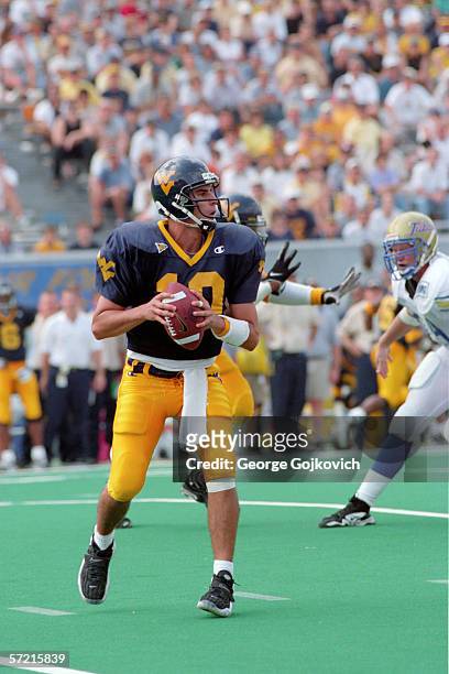 Quarterback Marc Bulger of the West Virginia University Mountaineers looks to pass during a game against the University of Tulsa at Mountaineer Field...