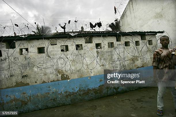 Man stands in the courtyard of the Bunia Prison March 30, 2006 in Bunia, Congo. The prison, which houses mainly former FARDC soldiers, the national...