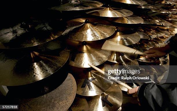 Visitor of the International Musikmesse plays Zildjian "K" cymbals on March 30, 2006 in Frankfurt, Germany. At the 27th Frankfurt Music Show, the...