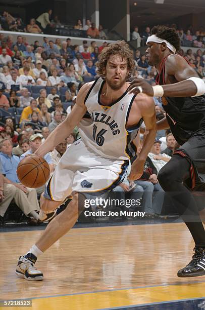 Pau Gasol of the Memphis Grizzlies drives around Samuel Dalembert of the Philadelphia 76ers on March 12, 2006 at the FedExForum in Memphis,...