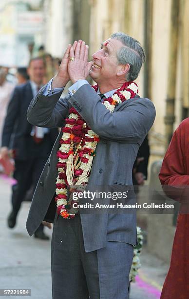 Prince Charles, Prince of Wales, garlanded and with a tilak mark on his forehead, takes a walking tour of the Old City on the final day of a 12 day...