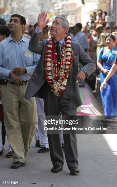 Prince Charles, Prince of Wales, garlanded and with a tilak mark on his forehead, takes a walking tour of the Old City on the final day of a 12 day...