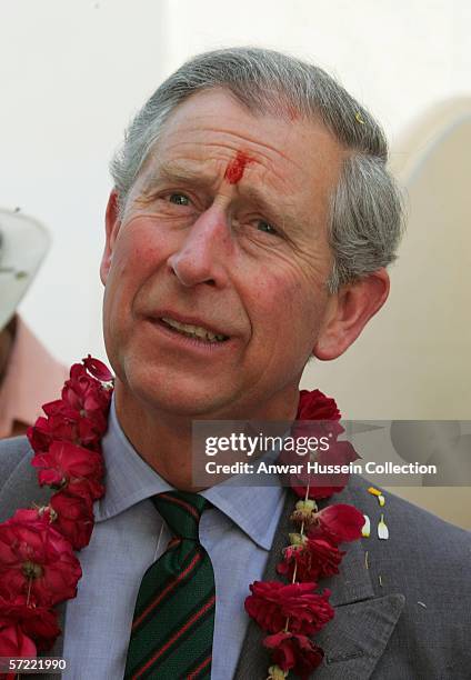 Prince Charles, Prince of Wales, garlanded and with a tilak mark on his forehead, takes a walking tour of the Old City on the final day of a 12 day...