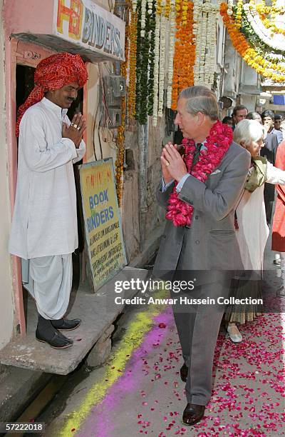 Prince Charles, Prince of Wales greets a shopkeeper as he takes a walking tour of the Old City on the final day of a 12 day official tour visiting...