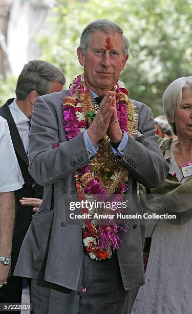 Prince Charles, Prince of Wales, garlanded and with a tilak mark on his forehead, takes a walking tour of the Old City on the final day of a 12 day...