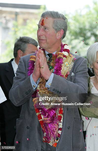 Prince Charles, Prince of Wales, garlanded and with a tilak mark on his forehead, takes a walking tour of the Old City on the final day of a 12 day...