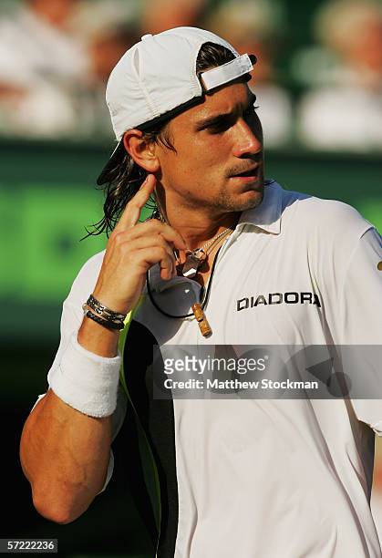David Ferrer of Spain looks down court against Andy Roddick in the quarterfinal match at the Nasdaq-100 Open at the Tennis Center at Crandon Park on...