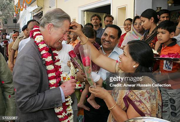 Prince Charles, Prince of Wales receives a tilak mark on his forehead as he takes a walking tour of the Old City on the final day of a 12 day...