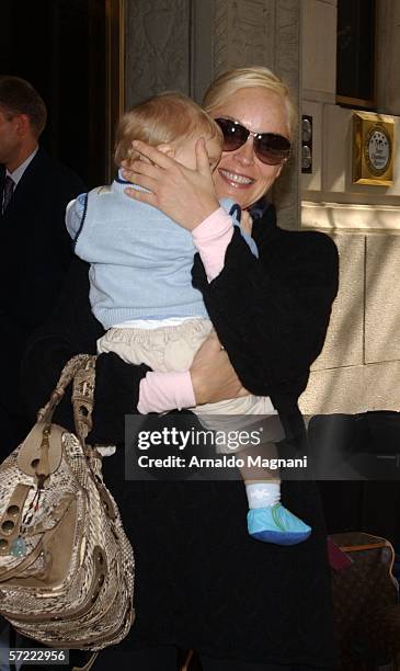 Sharon Stone holds her adopted baby Laird Vonne Stone as she leaves a midtown hotel March 31, 2006 in New York City.