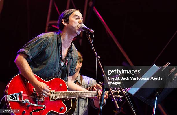 American musician David Garza plays guitar as he performs with the Watkins Family Hour Band during a performance in celebration of the 50th...