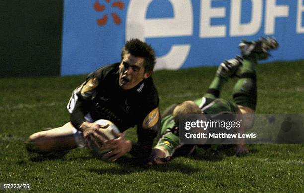 Toby Flood of Newcastle beats Stephen Knoop of Connacht to score a try during the European Challenge Cup Quarter Final match between Newcastle...