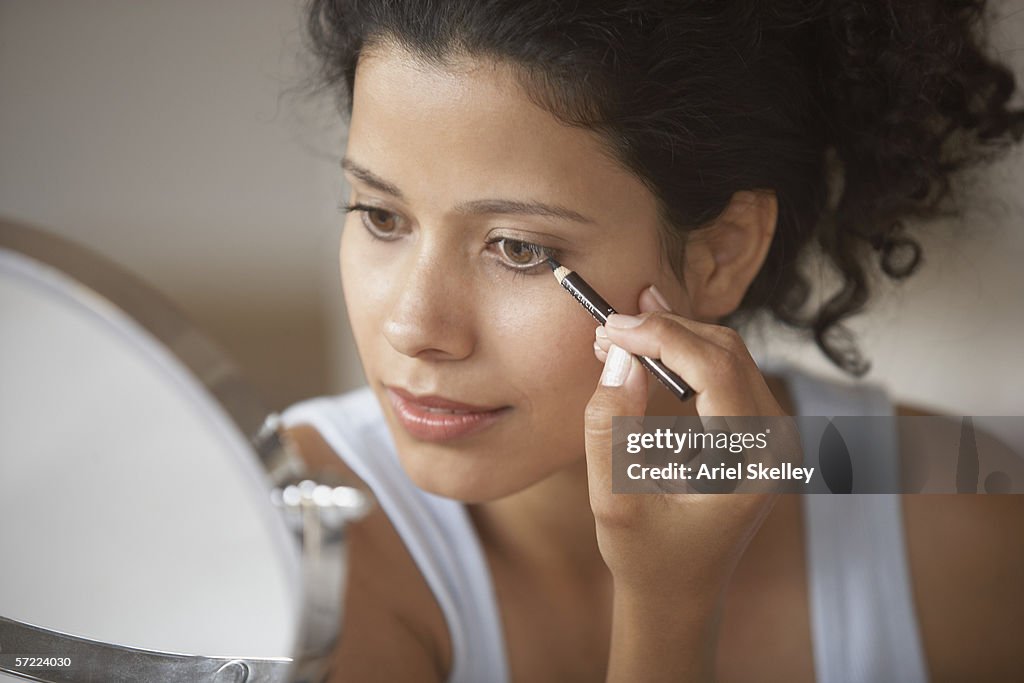 Woman putting on make-up