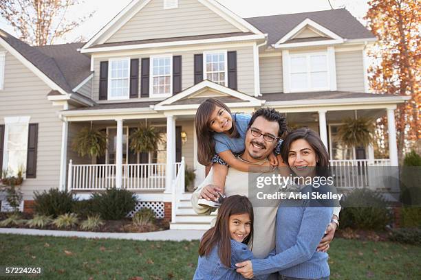 portrait of family in front of house - in front of stock pictures, royalty-free photos & images