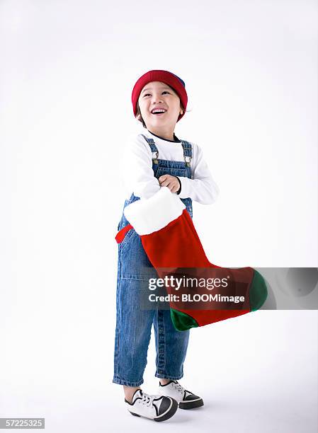 asian young boy smiling - kid stocking stock pictures, royalty-free photos & images