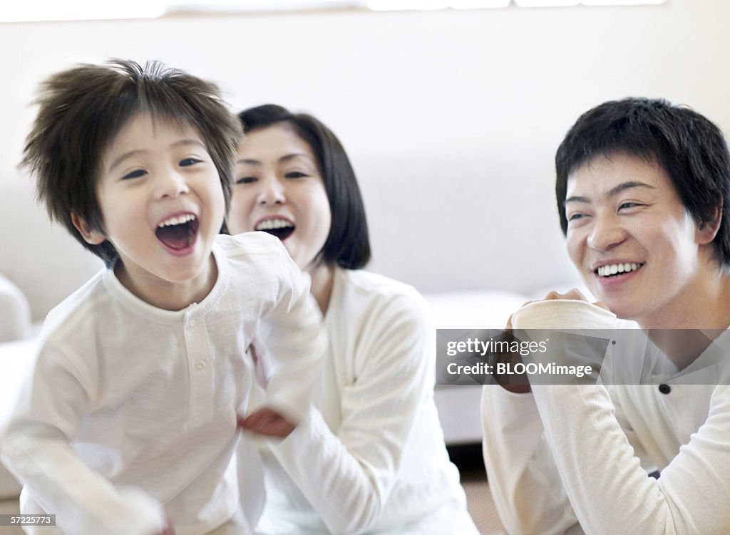 Japanese parents and young boy smiling