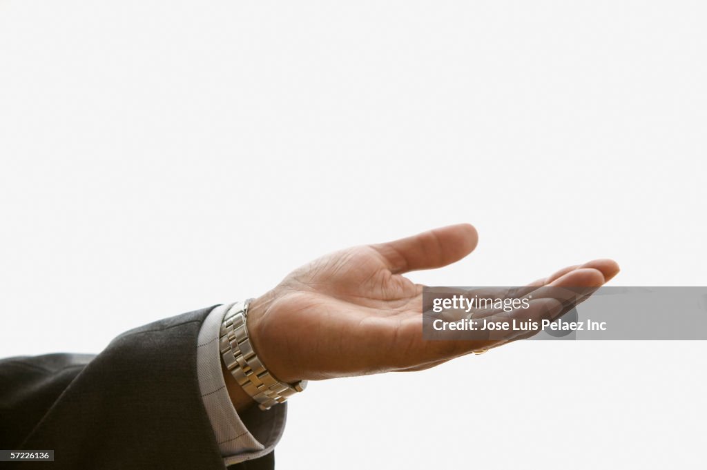 Close up of businessman's hand extended palm up