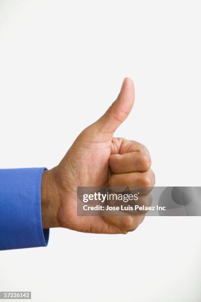 close up of hand giving thumbs up - black thumbs up white background stock-fotos und bilder