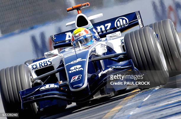 Mark Webber of Australia runs his Williams Cosworth wide on to the ripple strip during qualifying for the Australian Formula One Grand Prix in...