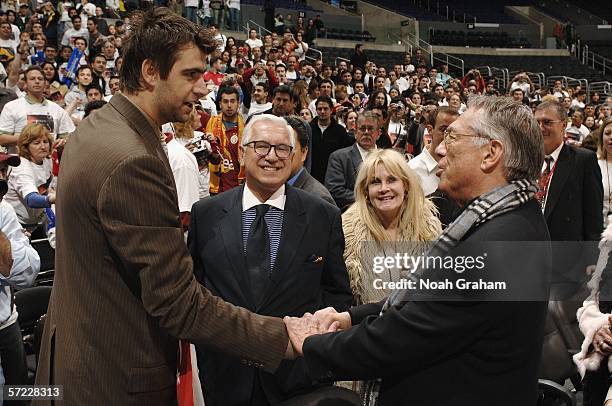 Mehmet Okur of the Utah Jazz shakes hands with Los Angeles Clippers owner Donald T. Sterling on March 31, 2006 at Staples Center in Los Angeles,...