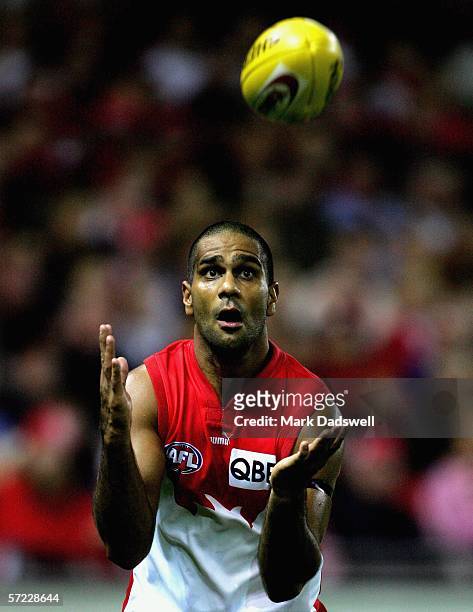 Michael O'Loughlin for the Swans keeps his eyes on the ball during the round one AFL match between the Essendon Bombers and the Sydney Swans at...