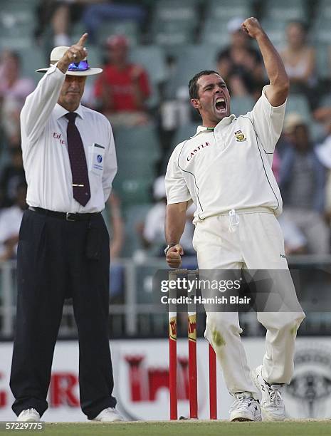 Nicky Boje of South Africa celebrates the wicket of Mike Hussey of Australia as umpire Tony Hill rules him out LBW during day two of the Third Test...