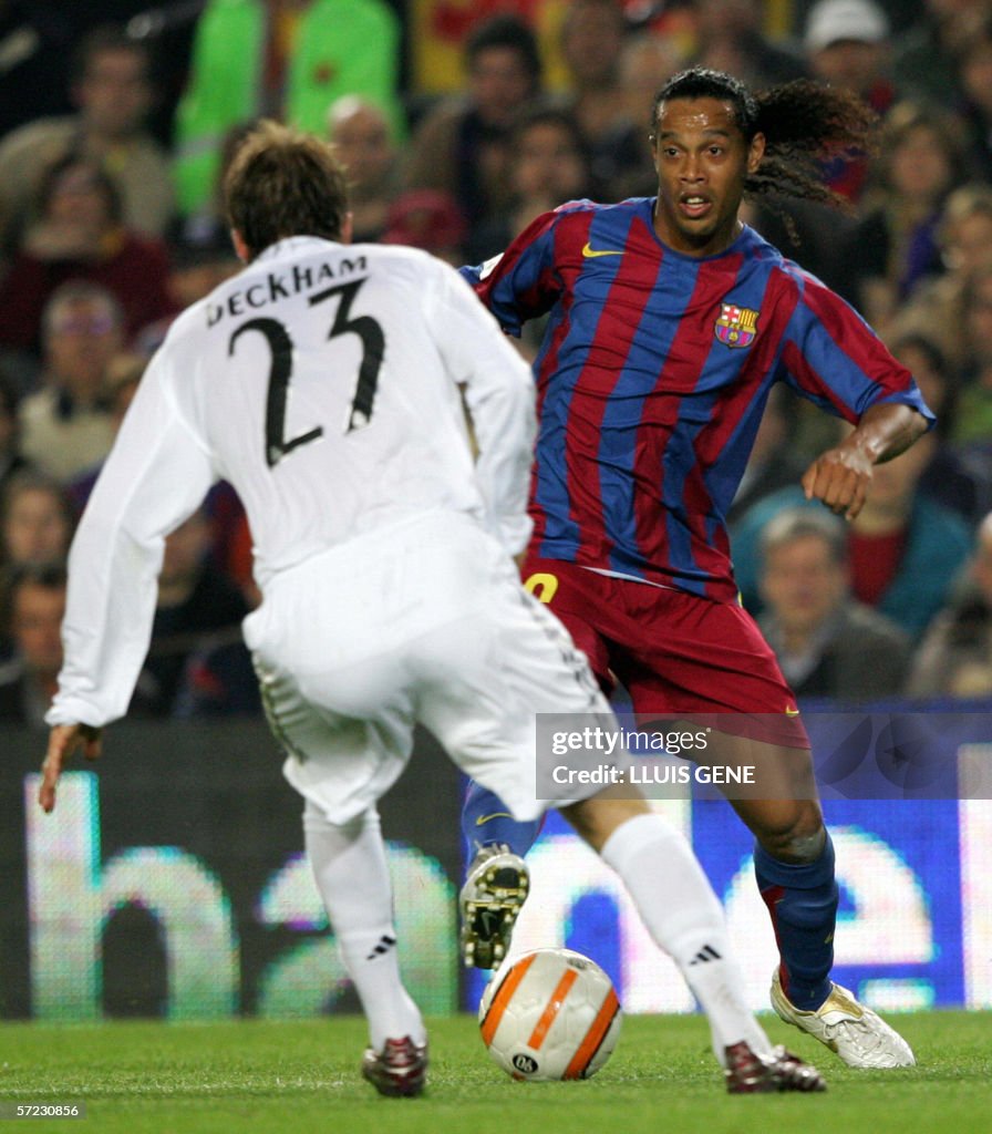 Barcelona's Brazilian Ronaldinho (R) tri