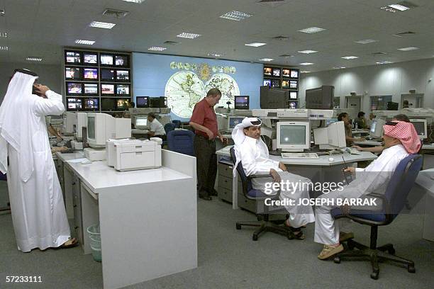 Asia-media-television-Jazeera,sched-FEATURE" This file photo dated 10 October 2001 shows Al-Jazeera staff working at the satellite channel's...