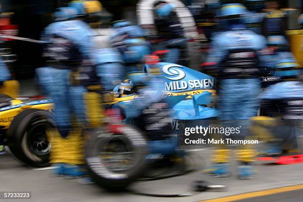 Fernando Alonso of Spain drives his Renault in for a pit stop during the Australian Formula One Grand Prix at the Albert Park Circuit on April 02,...