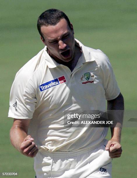 Johannesburg, SOUTH AFRICA: Australian Bowler Stuart Clark, celebrates getting out South Africa's batsman AB de Villiers for 4 runs in South Africa's...