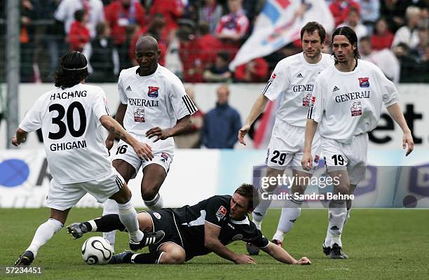 Patrick Ghigani , Darlington Omodiagbe , Kai Oswald , Stefan Buck of Unterhaching and Marcel Schied of Rostock in action during the Second Bundesliga...