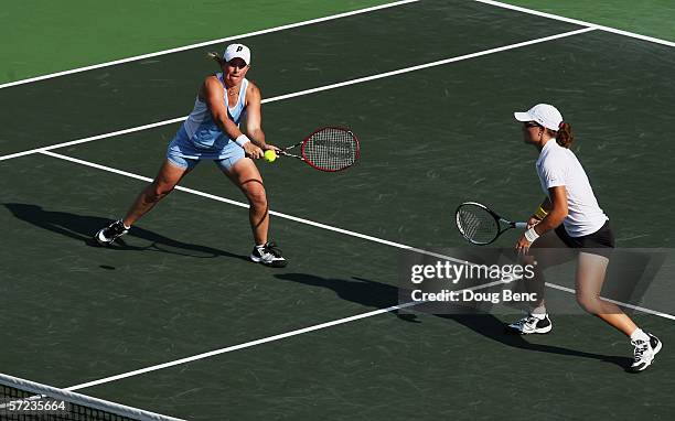 Samantha Stosur of Australia and Lisa Raymond return a shot to Martina Navratilova and Leisel Huber of South Africa during the women's doubles final...