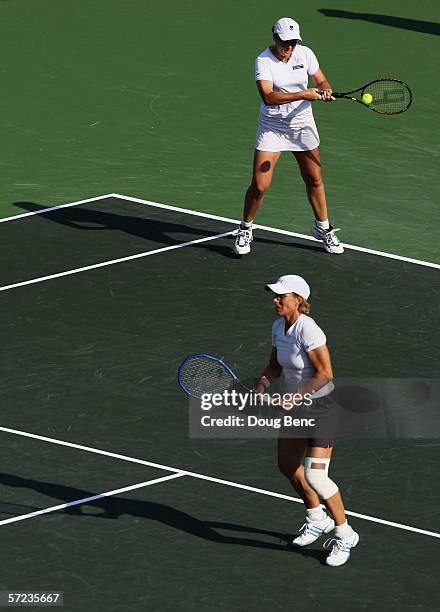 Martina Navratilova and Leisel Huber of South Africa returns a shot to Samantha Stosur of Australia and Lisa Raymond during the women's doubles final...